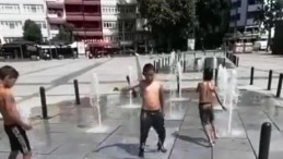 Çocuklar su fiskiyeleri altında serinlediler