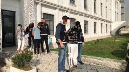 Kucağında bebekle adliyeye sevkedildi